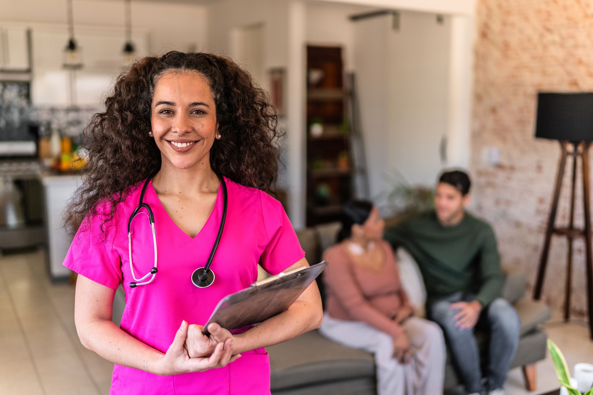 Portrait of mid adult nurse woman at house call